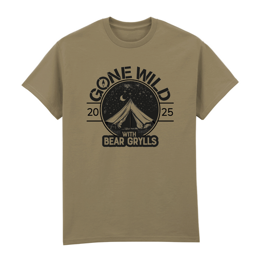 The Gone Wild Devon 2025 T-Shirt in khaki by 2025 features a tent, trees, night sky with moon and stars, and “Gone Wild 2025 with Bear Grylls” text.